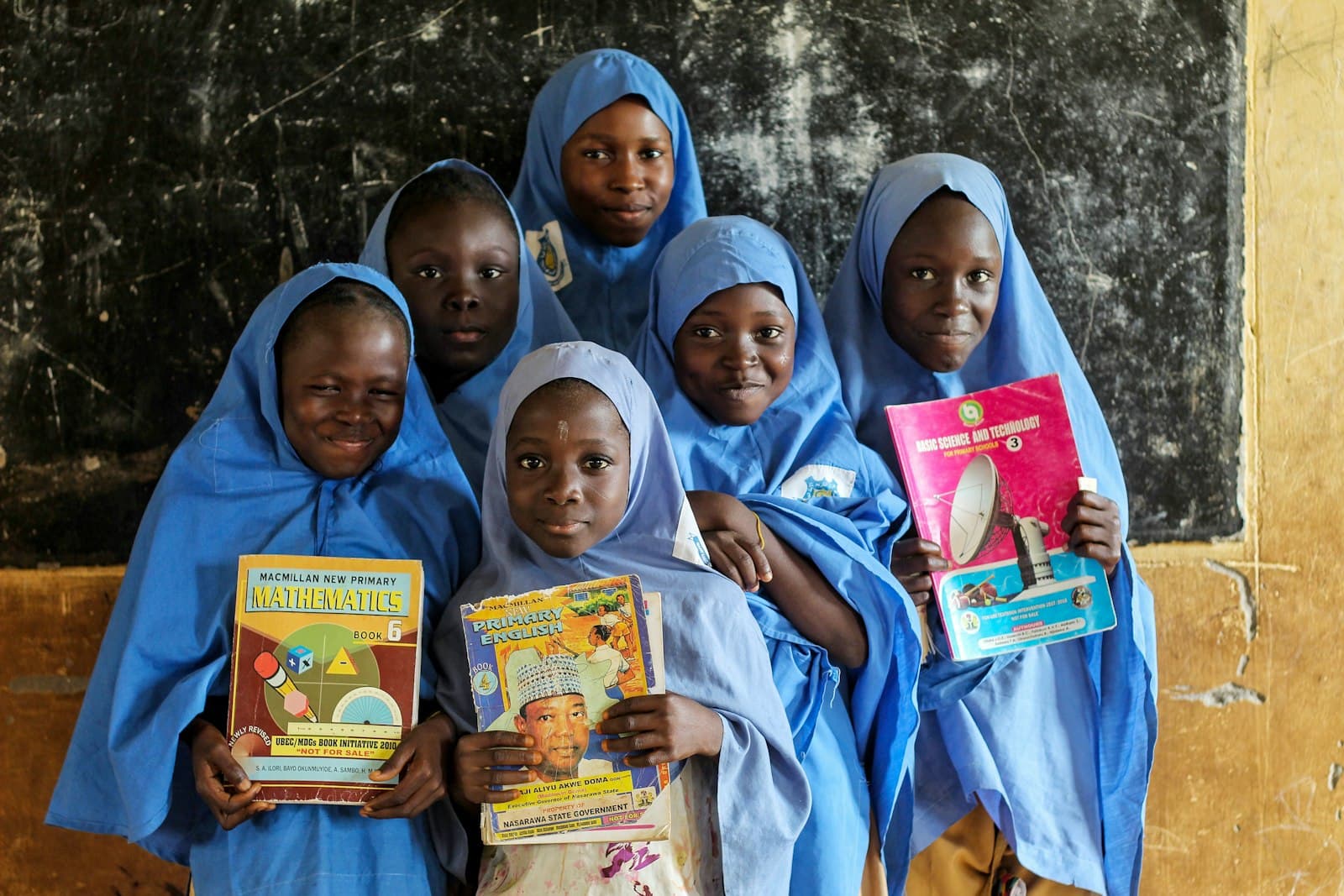 Students holding their schoolbooks